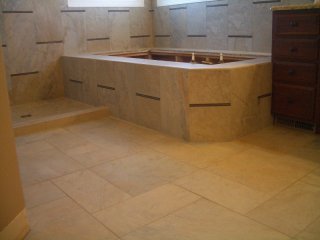 Porcelain and glass master bathroom tub deck