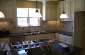 Porcelain kitchen backsplash with pewter inserts