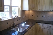 Porcelain kitchen backsplash with pewter inserts