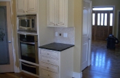 Porcelain kitchen backsplash with pewter inserts
