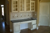 Porcelain kitchen backsplash with granite inserts