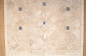 Travertine backsplash with pewter inserts