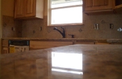 Porcelain backsplash with granite inserts