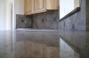 Porcelain backsplash with granite inserts and countertops