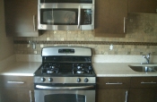 Porcelain mosaic backsplash with glass inserts