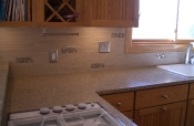 Porcelain mosaic backsplash with glass inserts