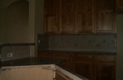 Porcelain backsplash with glass and travertine inserts