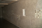 Porcelain backsplash with glass and travertine inserts