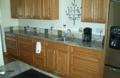 Porcelain backsplash with pewter inserts.