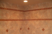 Porcelain master bathroom with glass inserts in Fort Collins