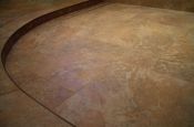 Porcelain and glass master bathroom shower with linear drain
