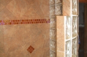 Porcelain master bathroom with glass inserts in Fort Collins
