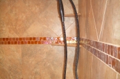 Porcelain master bathroom with glass inlay in Fort Collins