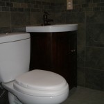 Slate-like porcelain master bathroom with free-standing vanity
