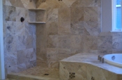 Travertine and glass Master bathroom shower tile in Windsor, Colorado