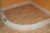 Porcelain shower floor with linear drain