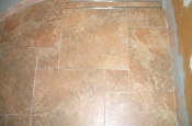 Porcelain pinwheel shower floor with Schluter tile-in linear drain