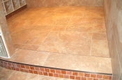 Taconic slate master bathroom shower with glass inlaid curb