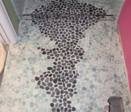 River rock design with linear drain