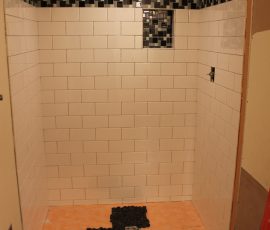 Subway shower with river rock floor