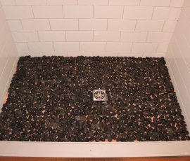 River rock mosaics on shower floor