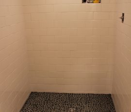 Black river rock shower floor